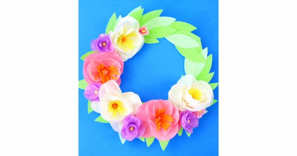 image shows floral wreath made from crepe paper.