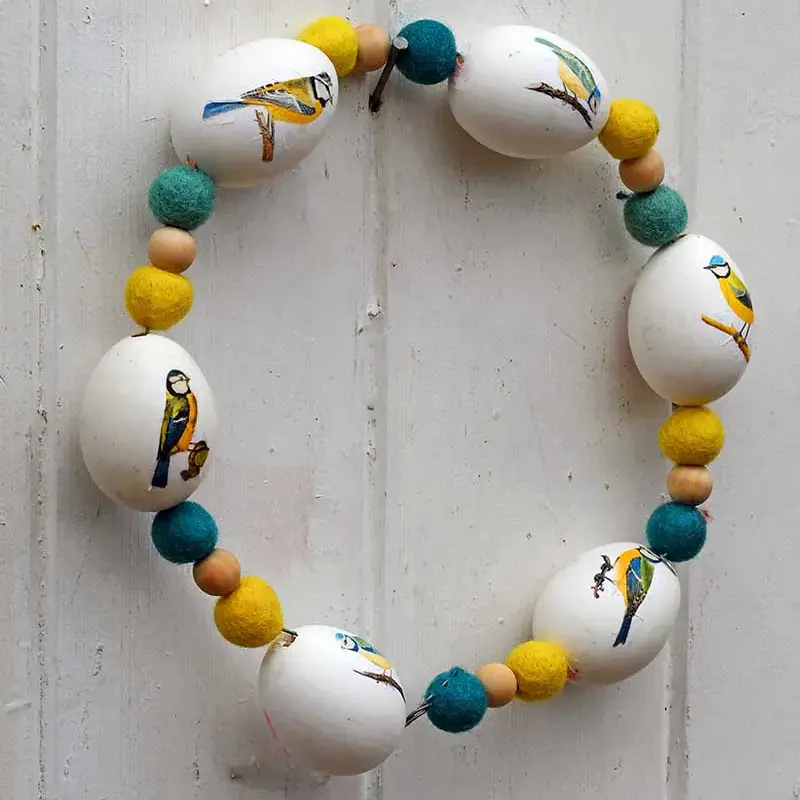 image shows blue and yellow bird wreath.